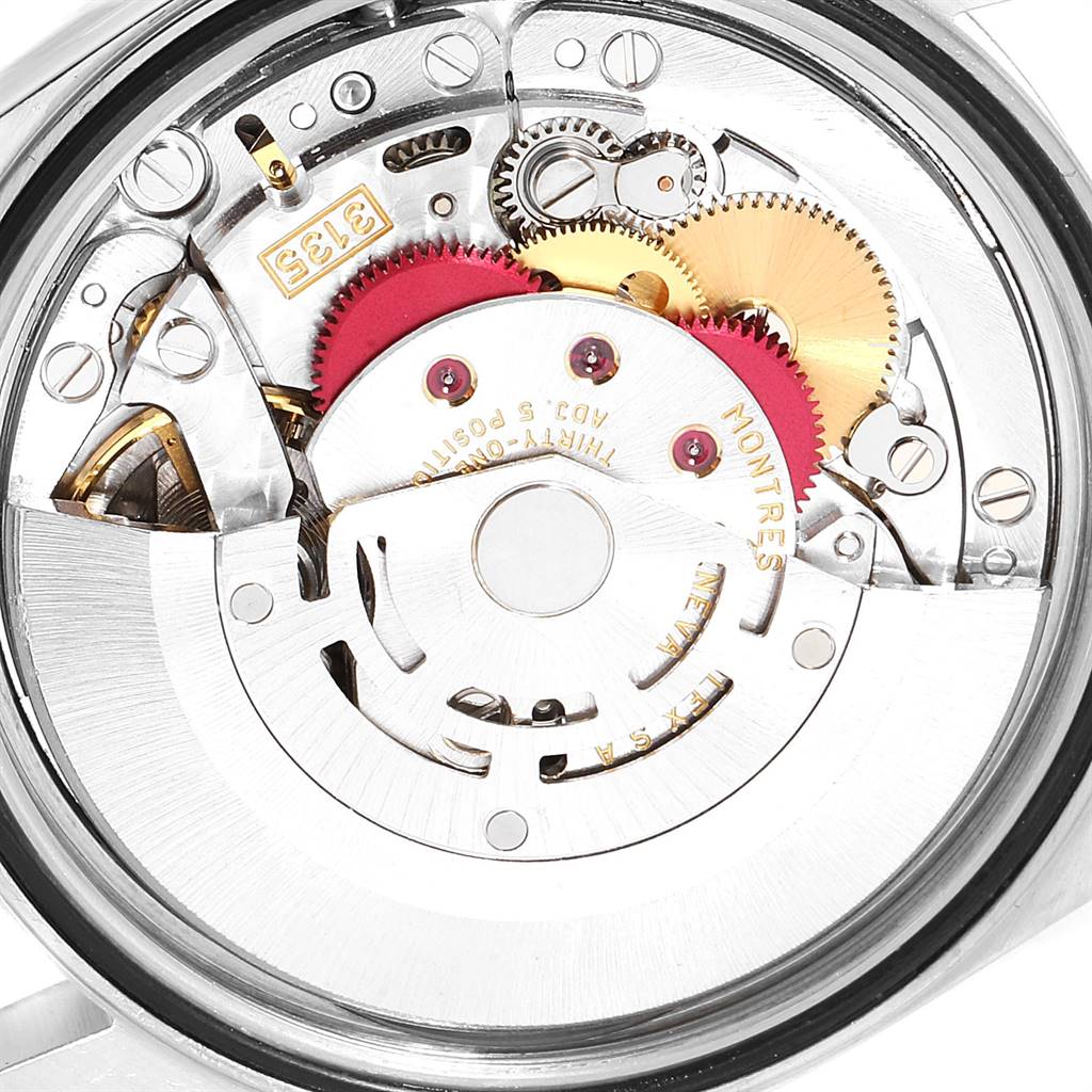 This image shows the internal mechanism and movement of the Rolex Datejust 16233 Men's Steel and Gold (two tone) White Dial 16233 Men's Steel and Gold (two tone) White Dial watch, highlighting its gears and components.