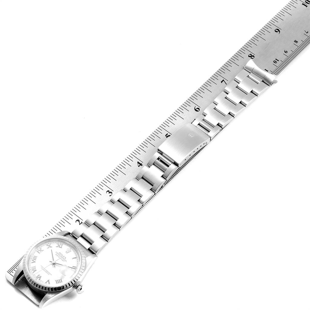 The image shows a Rolex Datejust 16220 Men's Stainless Steel White Dial 16220 Men's Stainless Steel White Dial watch laid flat with a ruler, displaying the watch face, bracelet, and clasp.