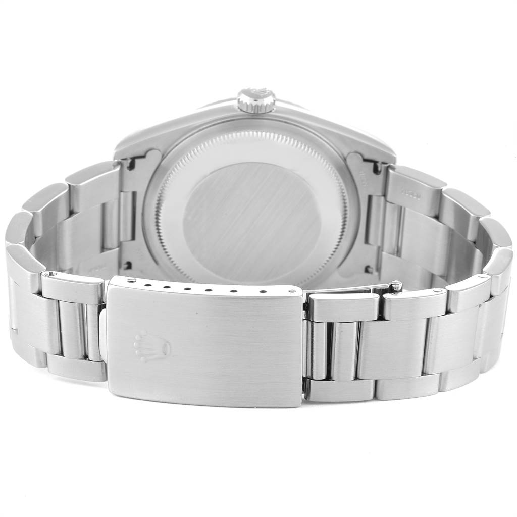 The image shows the back view of a Rolex Datejust 16220 Men's Stainless Steel White Dial 16220 Men's Stainless Steel White Dial watch, focusing on the closed clasp and stainless steel bracelet.