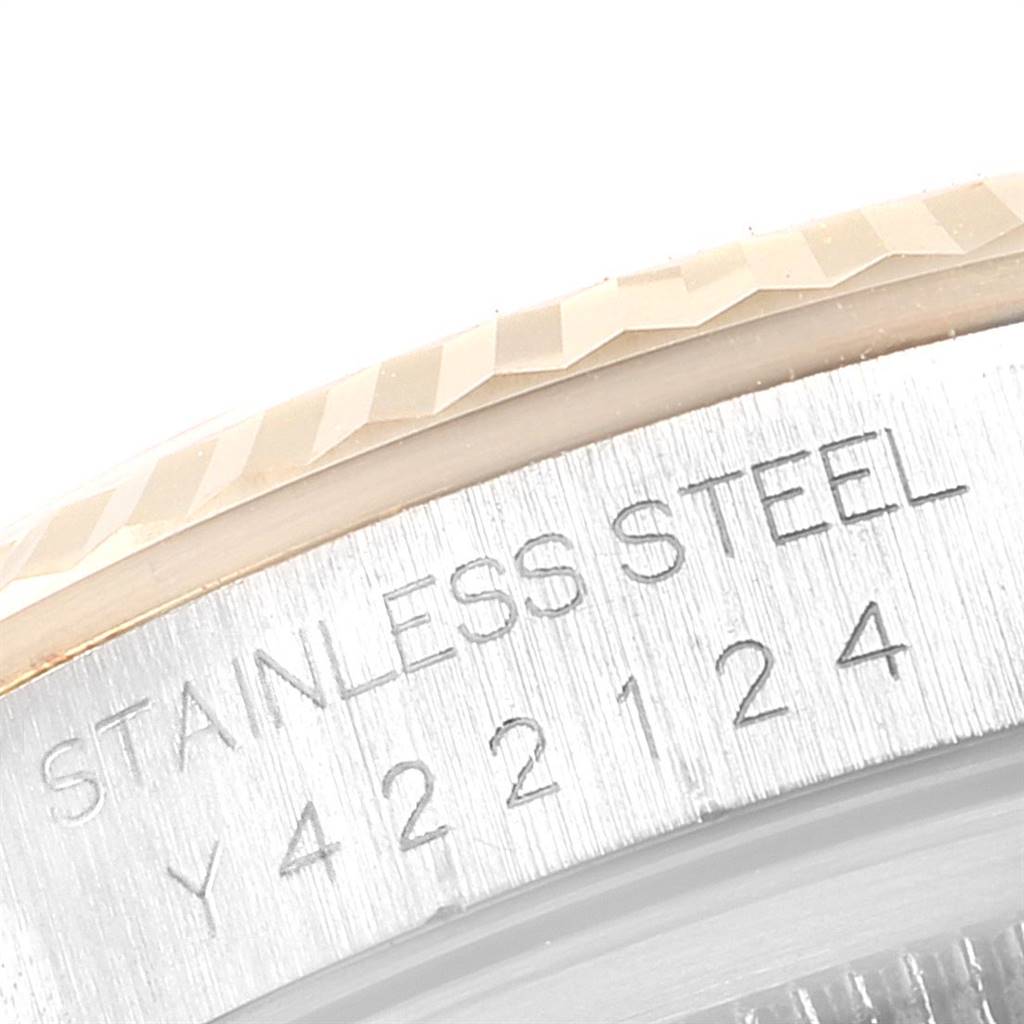 This image shows a close-up of the bezel and part of the case back engraving of a Rolex Datejust 16233 Men's Steel and Gold (two tone) White Dial 16233 Men's Steel and Gold (two tone) White Dial watch.