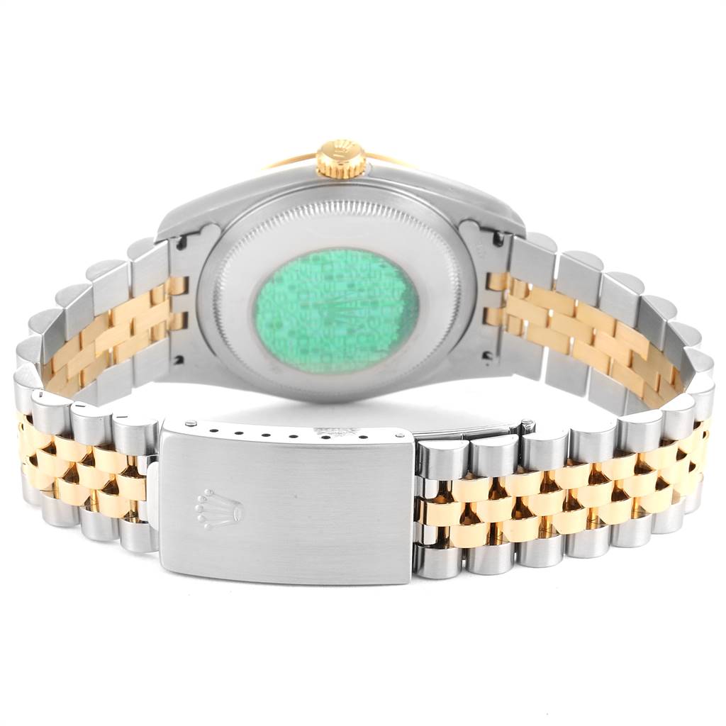 This image shows the back case and bracelet of a Rolex Datejust 16233 Men's Steel and Gold (two tone) White Dial 16233 Men's Steel and Gold (two tone) White Dial watch with two-tone metal links and a clasp.