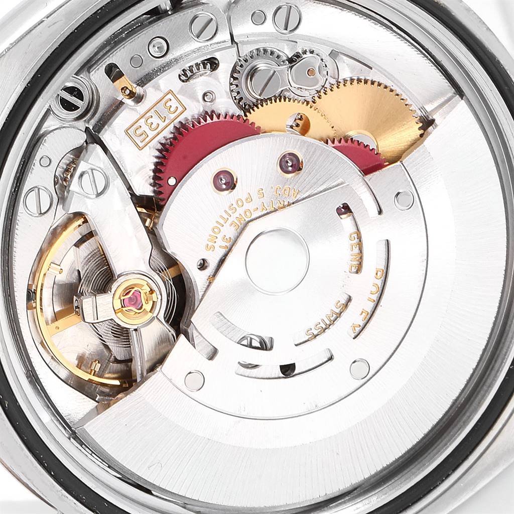 This image shows a close-up view of the Rolex Datejust 116231 Men's Steel and Gold (two tone) Grey Dial 116231 Men's Steel and Gold (two tone) Grey Dial movement mechanism, showcasing gears and intricate internal components.