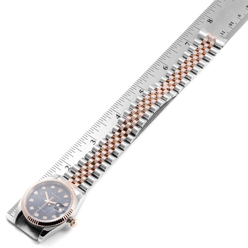 The image shows a Rolex Datejust 116231 Men's Steel and Gold (two tone) Blue Dial 116231 Men's Steel and Gold (two tone) Blue Dial watch laying flat with its two-tone bracelet alongside a ruler for measurement.