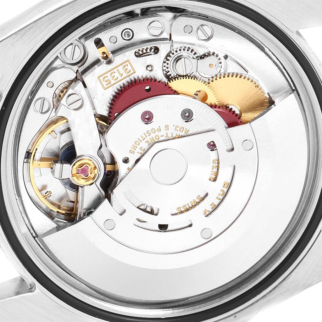 This image shows a close-up view of the inner mechanism of a Rolex Datejust 116231 Men's Steel and Gold (two tone) Blue Dial 116231 Men's Steel and Gold (two tone) Blue Dial watch, highlighting its gears and components.