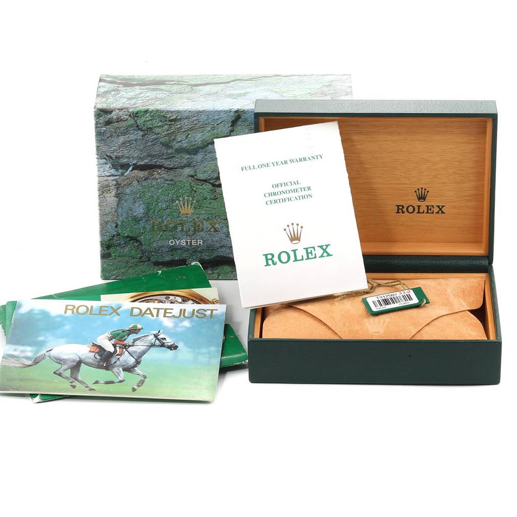 The image shows the Rolex Datejust 16233 Men's Steel and Gold (two tone) Champagne Dial 16233 Men's Steel and Gold (two tone) Champagne Dial watch box, warranty card, manual, and green tag.