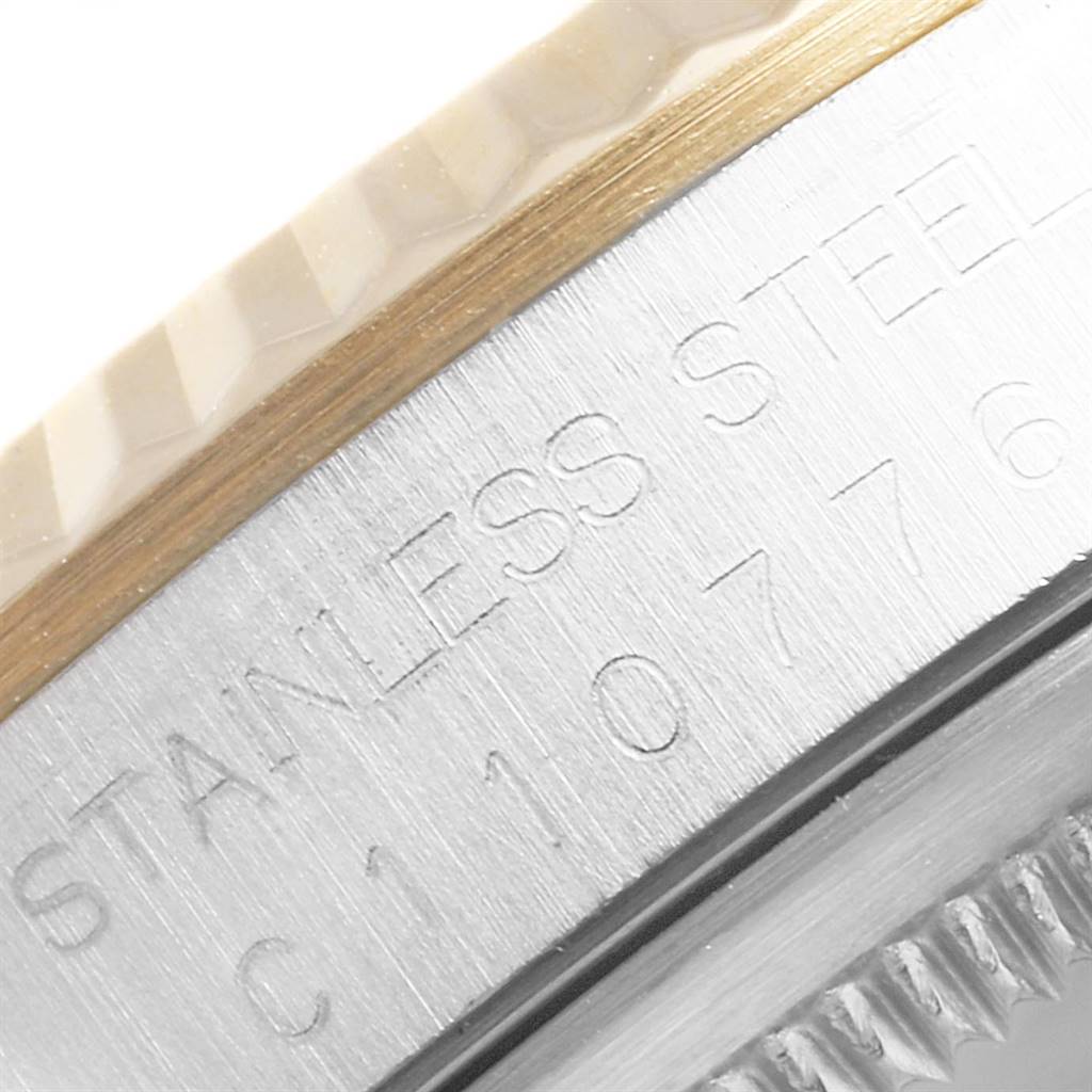 This close-up angle of the Rolex Datejust 16233 Men's Steel and Gold (two tone) Champagne Dial 16233 Men's Steel and Gold (two tone) Champagne Dial shows the engraved "Stainless Steel" text on the side of the watch case.