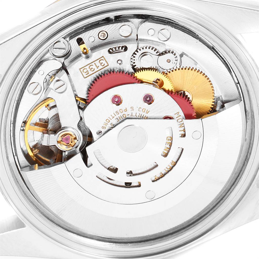 The image shows the internal movement of a Rolex Datejust 16233 Men's Steel and Gold (two tone) Champagne Dial 16233 Men's Steel and Gold (two tone) Champagne Dial watch, viewed from the back, highlighting gears and mechanisms.