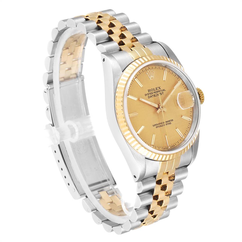 This image shows a Rolex Datejust 16233 Men's Steel and Gold (two tone) Champagne Dial 16233 Men's Steel and Gold (two tone) Champagne Dial model watch angled to highlight its face, bezel, and two-tone bracelet.