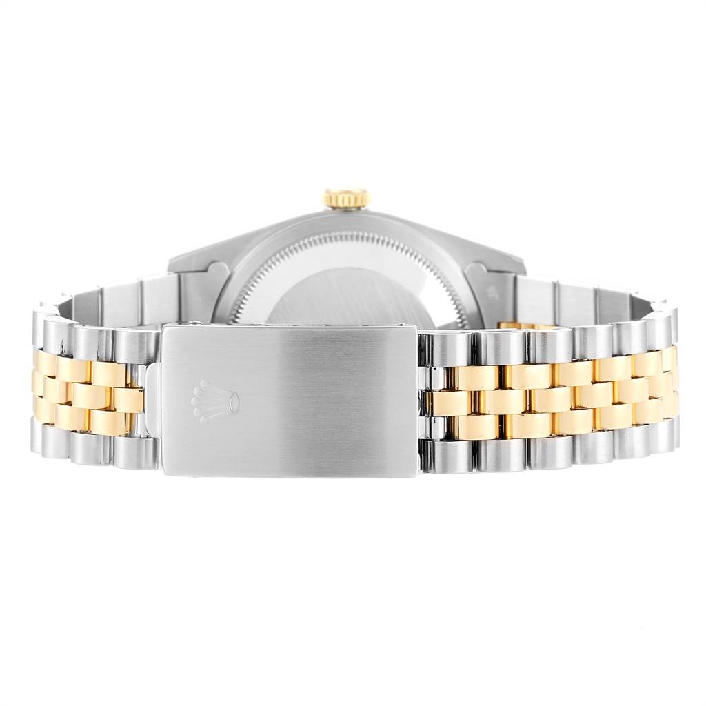 This image shows the back case and bracelet clasp of a Rolex Datejust 16233 Men's Steel and Gold (two tone) Champagne Dial 16233 Men's Steel and Gold (two tone) Champagne Dial model.