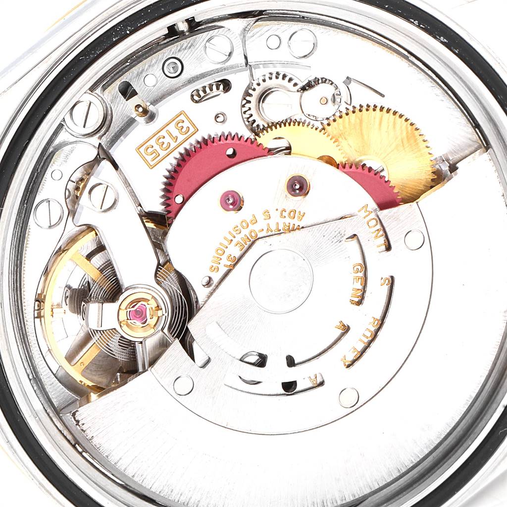This image shows the inner mechanical movement of the Rolex Datejust 16233 Men
s Steel and Gold (two tone) Beige Dial 16233 Men
s Steel and Gold (two tone) Beige Dial watch at a close-up angle.