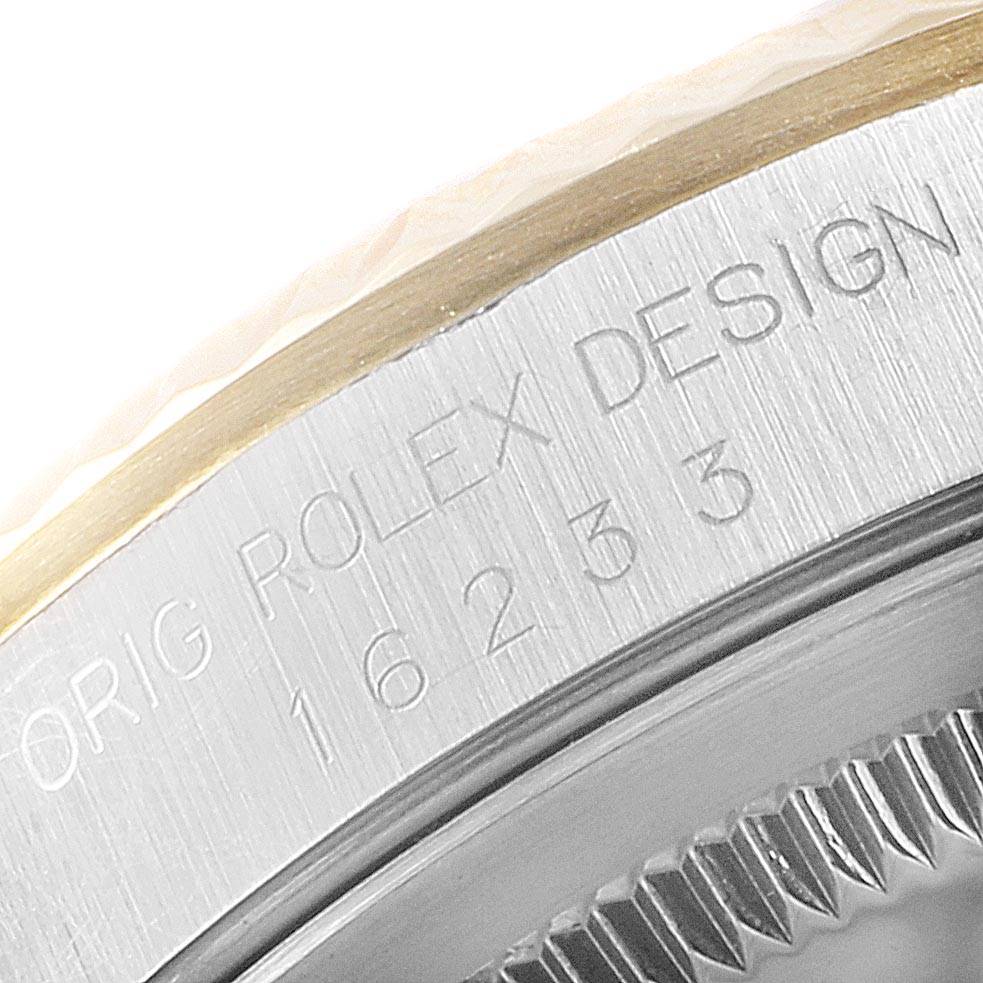 The image shows a close-up of the bezel and the engraved side of the case of a Rolex Datejust 16233 Men
s Steel and Gold (two tone) Champagne Dial 16233 Men
s Steel and Gold (two tone) Champagne Dial watch.