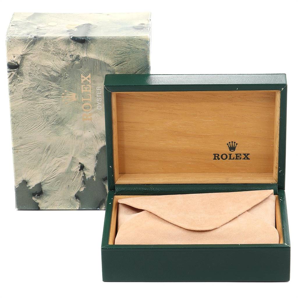 The image shows an open Rolex Datejust 16233 Men
s Steel and Gold (two tone) Champagne Dial 16233 Men
s Steel and Gold (two tone) Champagne Dial watch box with its lid raised, revealing a folded beige watch pouch inside.