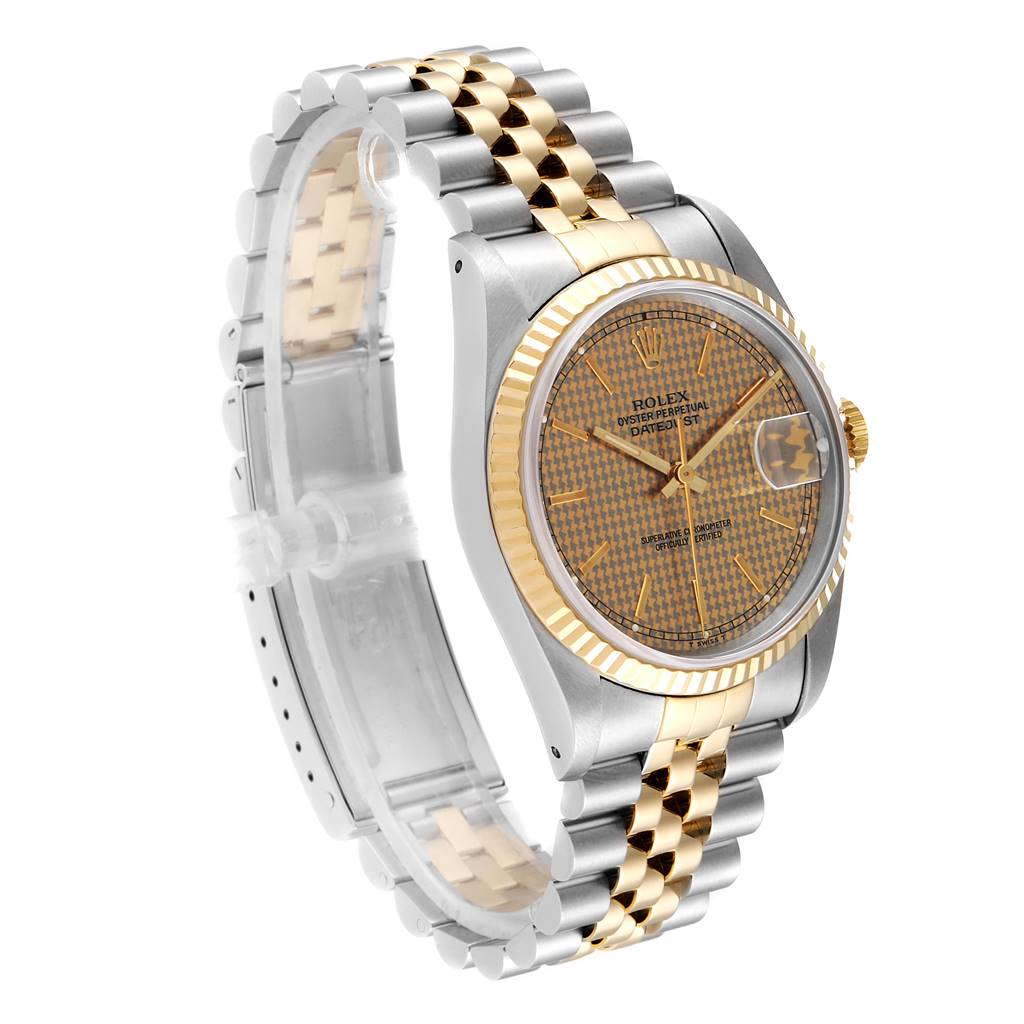 This image shows a Rolex Datejust 16233 Men
s Steel and Gold (two tone) Champagne Dial 16233 Men
s Steel and Gold (two tone) Champagne Dial watch viewed from an angle highlighting the face, bezel, and bracelet.
