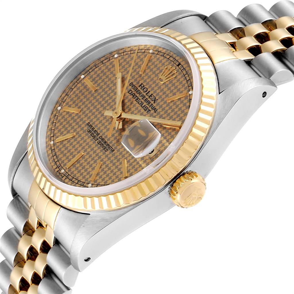 This image shows a Rolex Datejust 16233 Men
s Steel and Gold (two tone) Champagne Dial 16233 Men
s Steel and Gold (two tone) Champagne Dial watch at an angled side view, highlighting the gold bezel, crown, and two-tone bracelet.