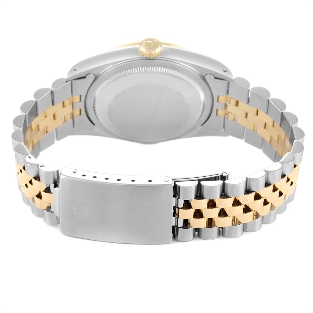 This image shows the back case and Jubilee bracelet of a Rolex Datejust 16233 Men
s Steel and Gold (two tone) Champagne Dial 16233 Men
s Steel and Gold (two tone) Champagne Dial watch, highlighting the clasp and two-tone link design.