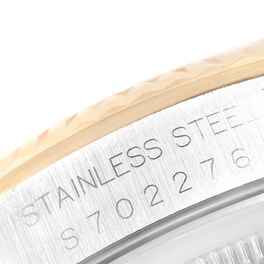 The image shows a close-up of the engraving on the side of a Rolex Datejust 16233 Men's Steel and Gold (two tone) Champagne Dial 16233 Men's Steel and Gold (two tone) Champagne Dial stainless steel watch.