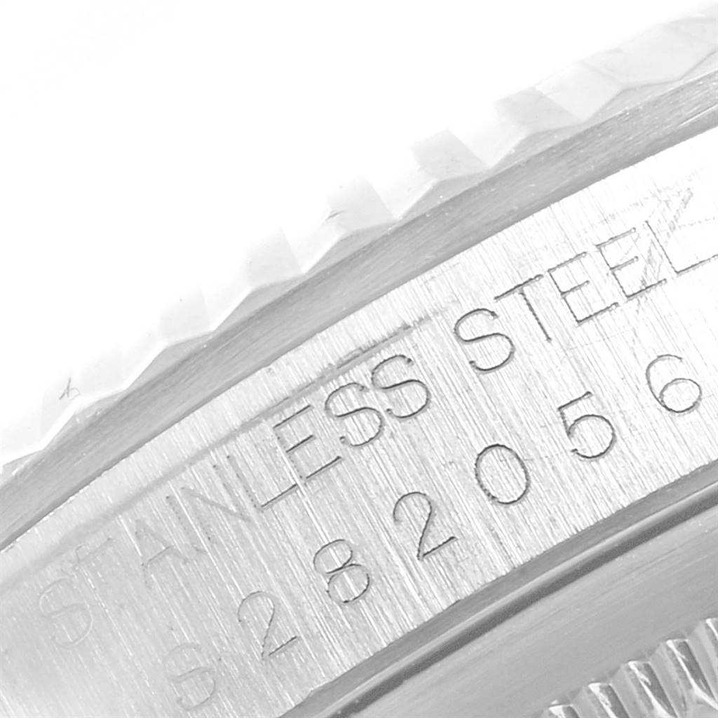 This image shows a close-up view of the edge and serial number engraving on a stainless steel Rolex Datejust 16234 Men's Stainless Steel Silver Dial 16234 Men's Stainless Steel Silver Dial watch bezel.