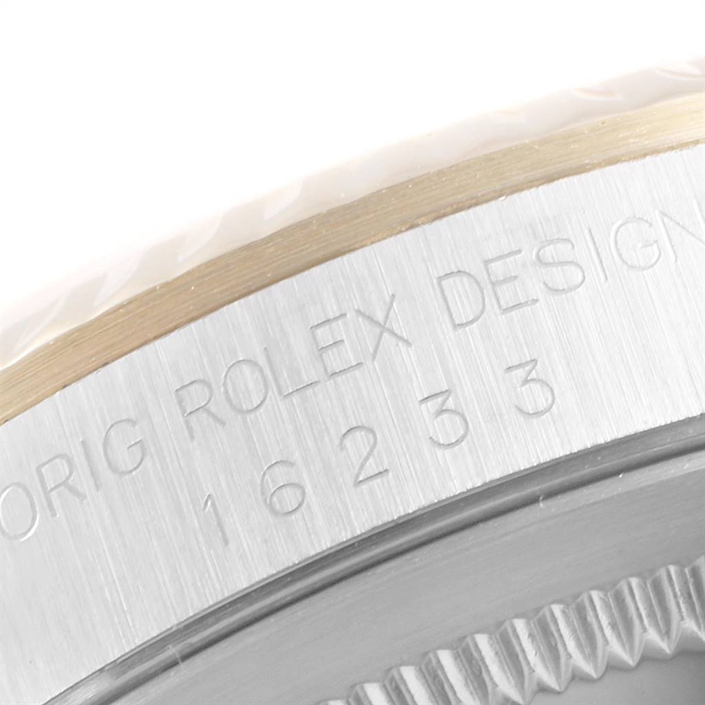 The image shows a close-up of the side of the Rolex Datejust 16233 Men's Steel and Gold (two tone) Champagne Dial 16233 Men's Steel and Gold (two tone) Champagne Dial watch case with model number and partially visible bezel.