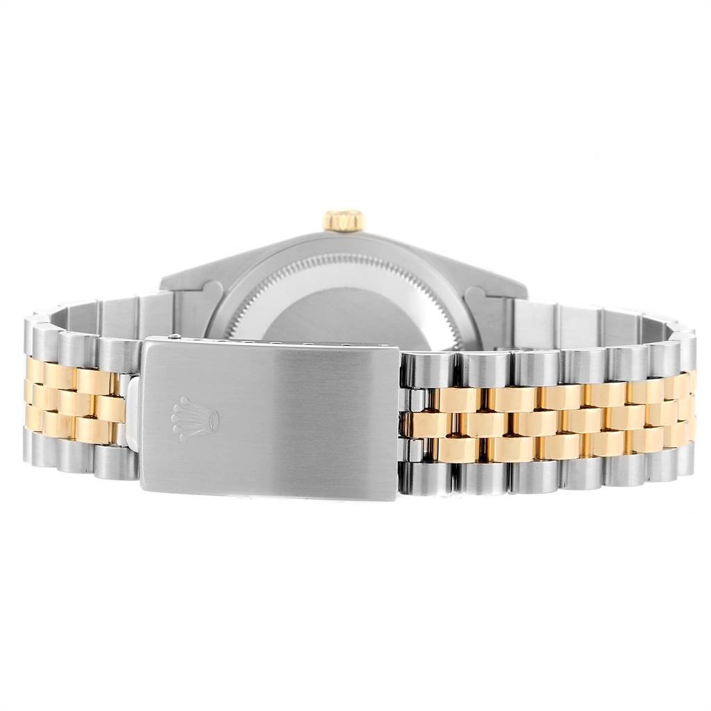 The image shows the back of a Rolex Datejust 16233 Men's Steel and Gold (two tone) Champagne Dial 16233 Men's Steel and Gold (two tone) Champagne Dial watch, highlighting its two-tone Jubilee bracelet and clasp.