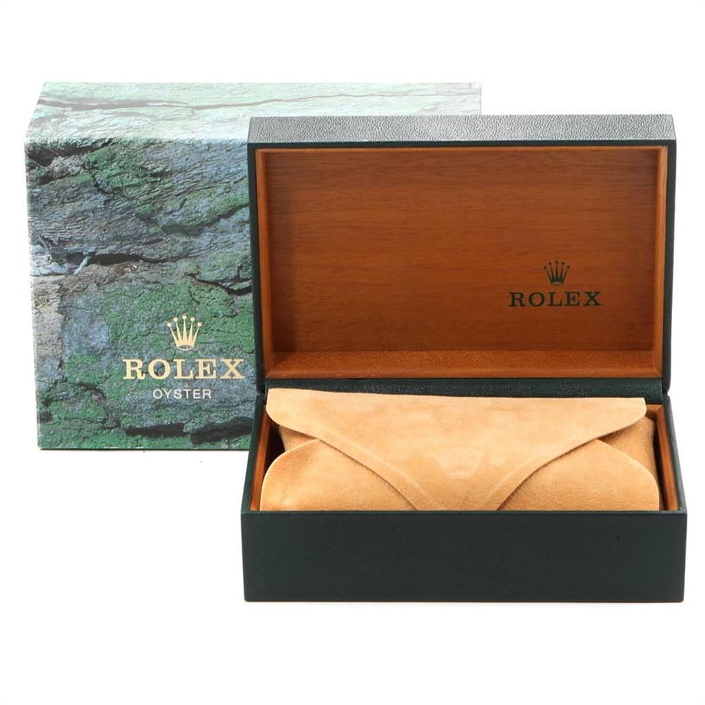 The image shows the packaging for a Rolex Datejust 16233 Men's Steel and Gold (two tone) Champagne Dial 16233 Men's Steel and Gold (two tone) Champagne Dial, including a textured outer box, a wooden inner box, and a suede watch pouch.