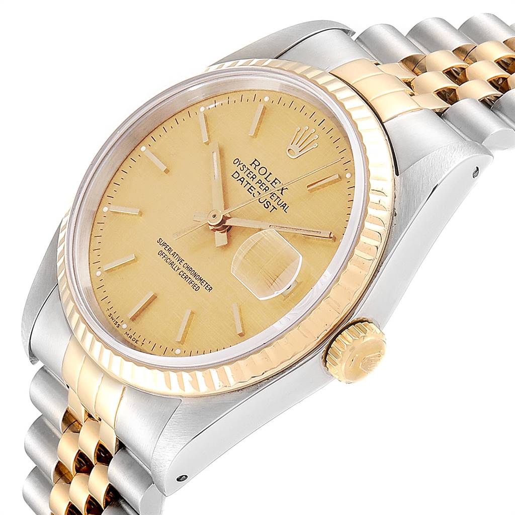 This Rolex Datejust 16233 Men's Steel and Gold (two tone) Champagne Dial 16233 Men's Steel and Gold (two tone) Champagne Dial watch is shown at an angle, displaying its face, bezel, crown, and portion of the bracelet.