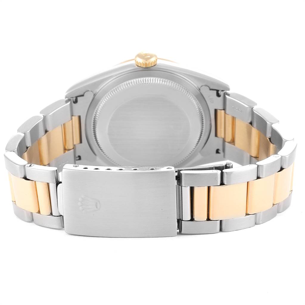 The image shows the back view of a Rolex Datejust 16233 Men's Steel and Gold (two tone) Mother of Pearl Dial 16233 Men's Steel and Gold (two tone) Mother of Pearl Dial watch, featuring its case back and stainless steel and gold bracelet.