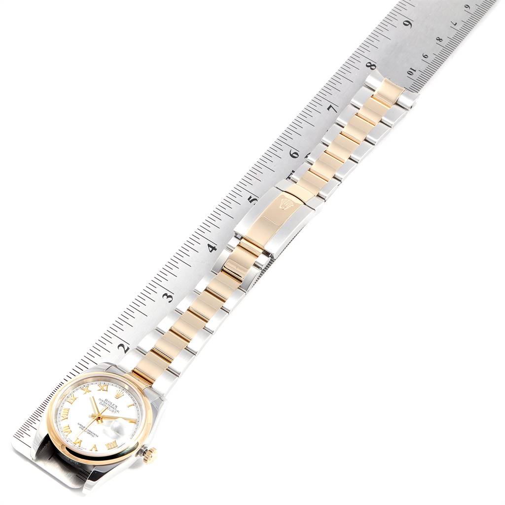 This image shows a top view of a Rolex Datejust 116203 Men's Stainless Steel White Dial 116203 Men's Stainless Steel White Dial watch alongside a ruler that measures its length.