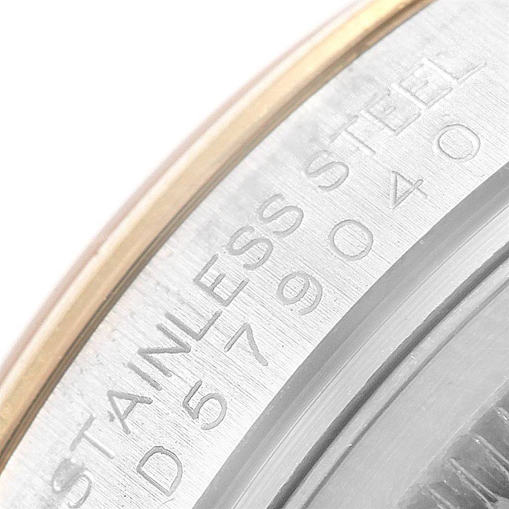 Close-up of the Rolex Datejust 116203 Men's Stainless Steel White Dial 116203 Men's Stainless Steel White Dial watch, showing the stainless steel bezel with engraved text.