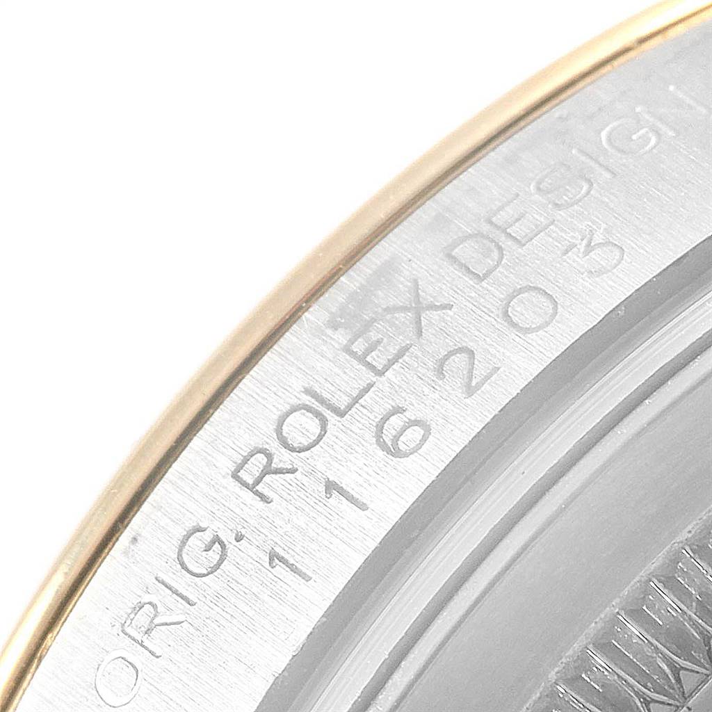 This image shows a close-up of the engraved case back of a Rolex Datejust 116203 Men's Stainless Steel White Dial 116203 Men's Stainless Steel White Dial watch, highlighting the model number and brand inscription.