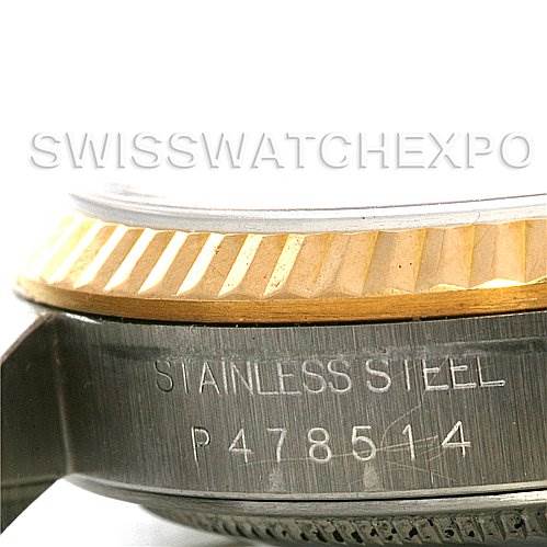 This image shows a close-up side view of the stainless steel case and fluted bezel of the Rolex Datejust 16233 Men's Steel and Gold (two tone) White Dial 16233 Men's Steel and Gold (two tone) White Dial watch.