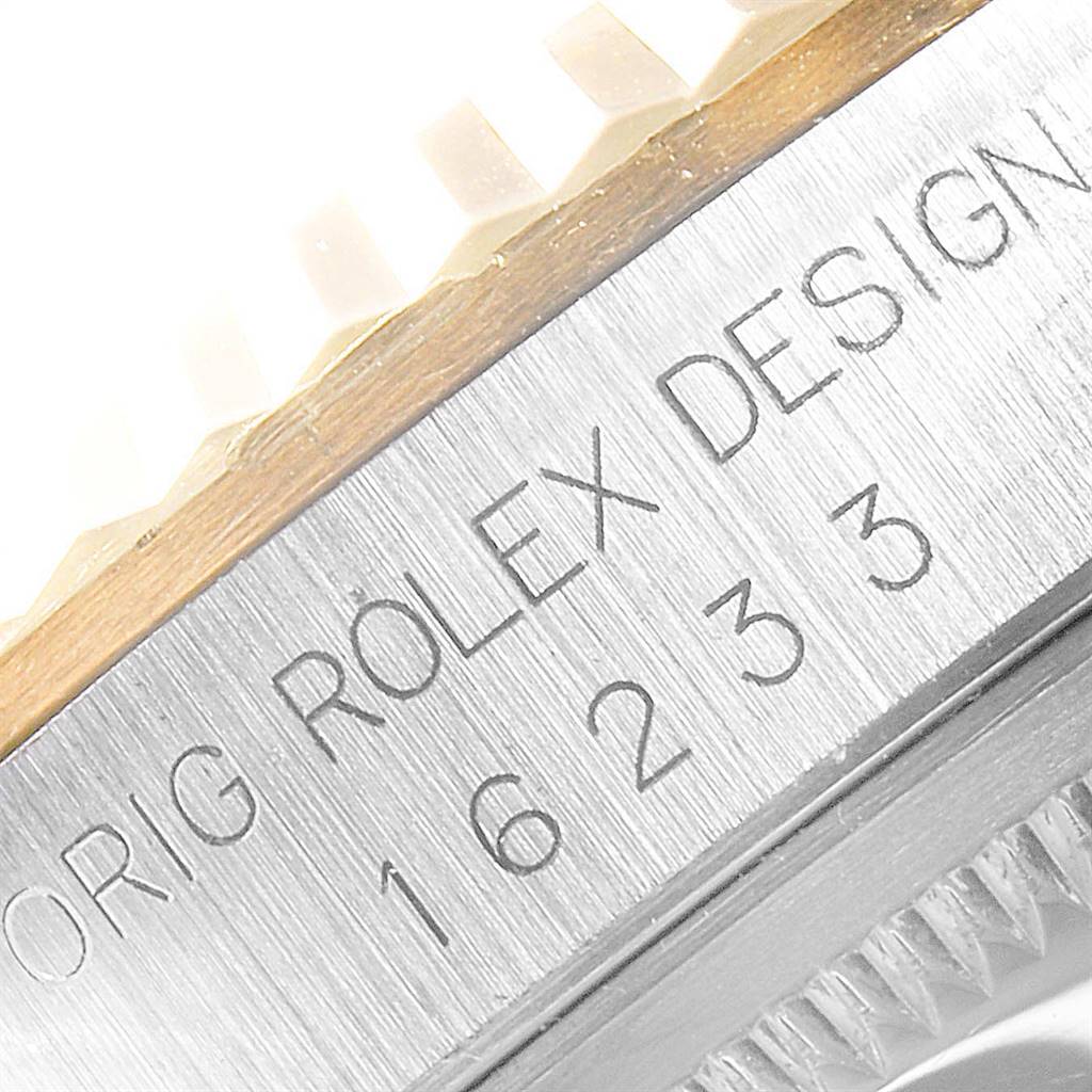 This image shows a close-up view of the case side and bezel edge of a Rolex Datejust 16233 Men
s Steel and Gold (two tone) Black Dial 16233 Men
s Steel and Gold (two tone) Black Dial.