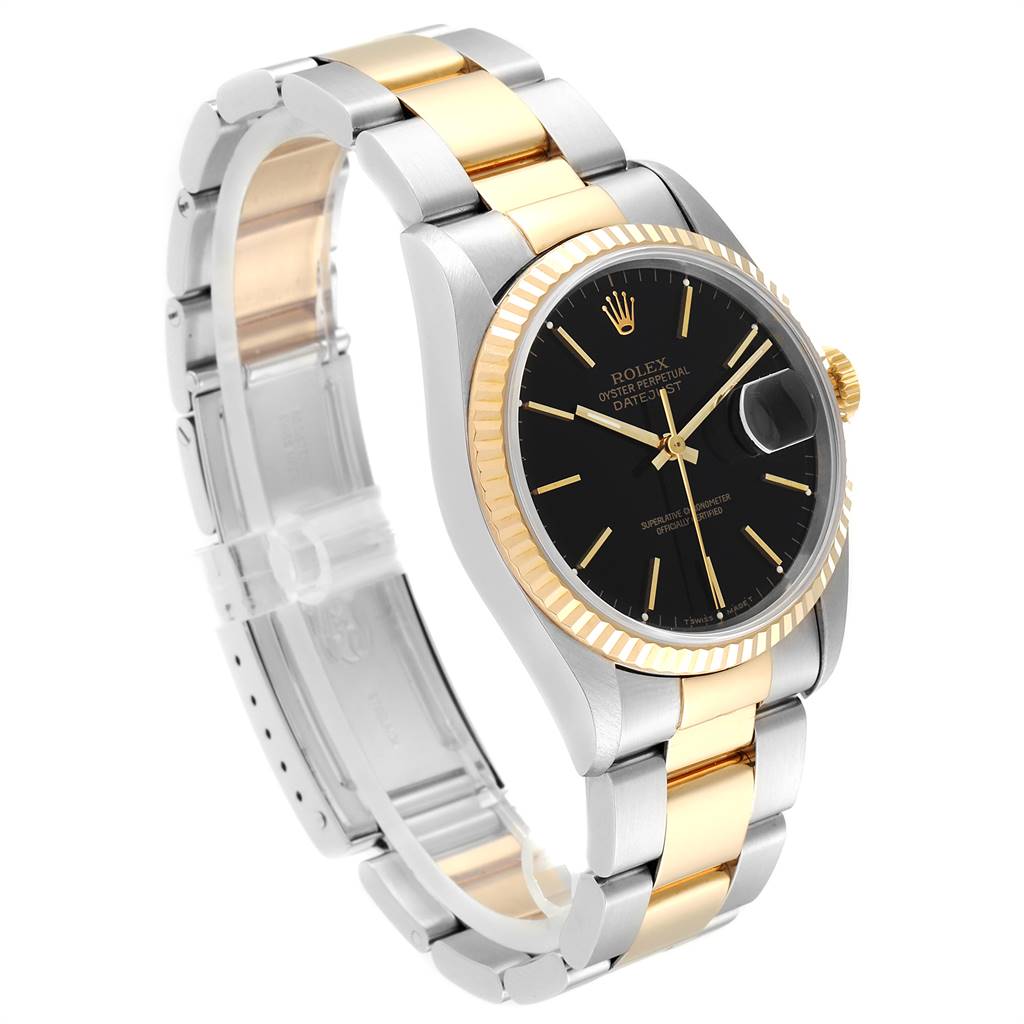 The Rolex Datejust 16233 Men
s Steel and Gold (two tone) Black Dial 16233 Men
s Steel and Gold (two tone) Black Dial watch is shown at a three-quarter angle, highlighting its black dial, fluted bezel, and two-tone bracelet.