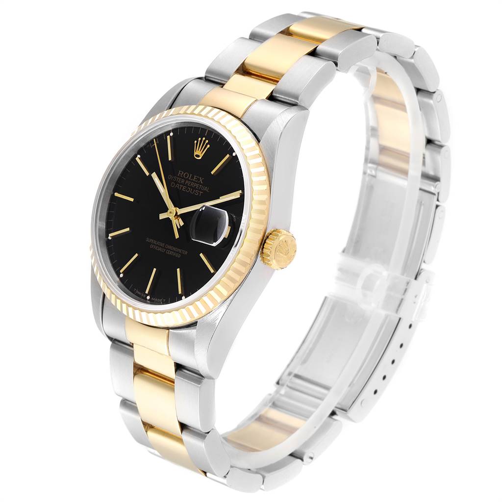The image shows a Rolex Datejust 16233 Men
s Steel and Gold (two tone) Black Dial 16233 Men
s Steel and Gold (two tone) Black Dial watch at a slight angle, highlighting its black dial, gold bezel, and two-tone bracelet.
