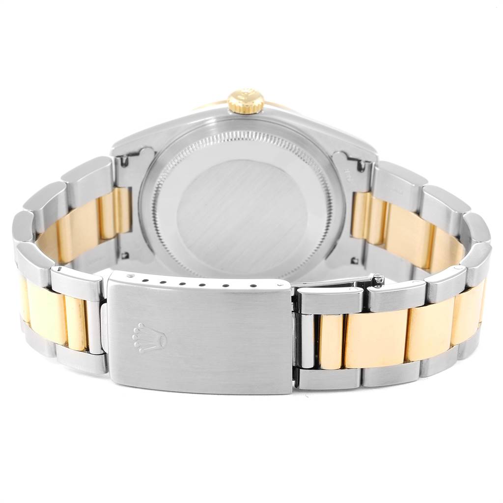 This image shows the back case and bracelet of a Rolex Datejust 16233 Men
s Steel and Gold (two tone) Black Dial 16233 Men
s Steel and Gold (two tone) Black Dial watch, including the clasp and crown.