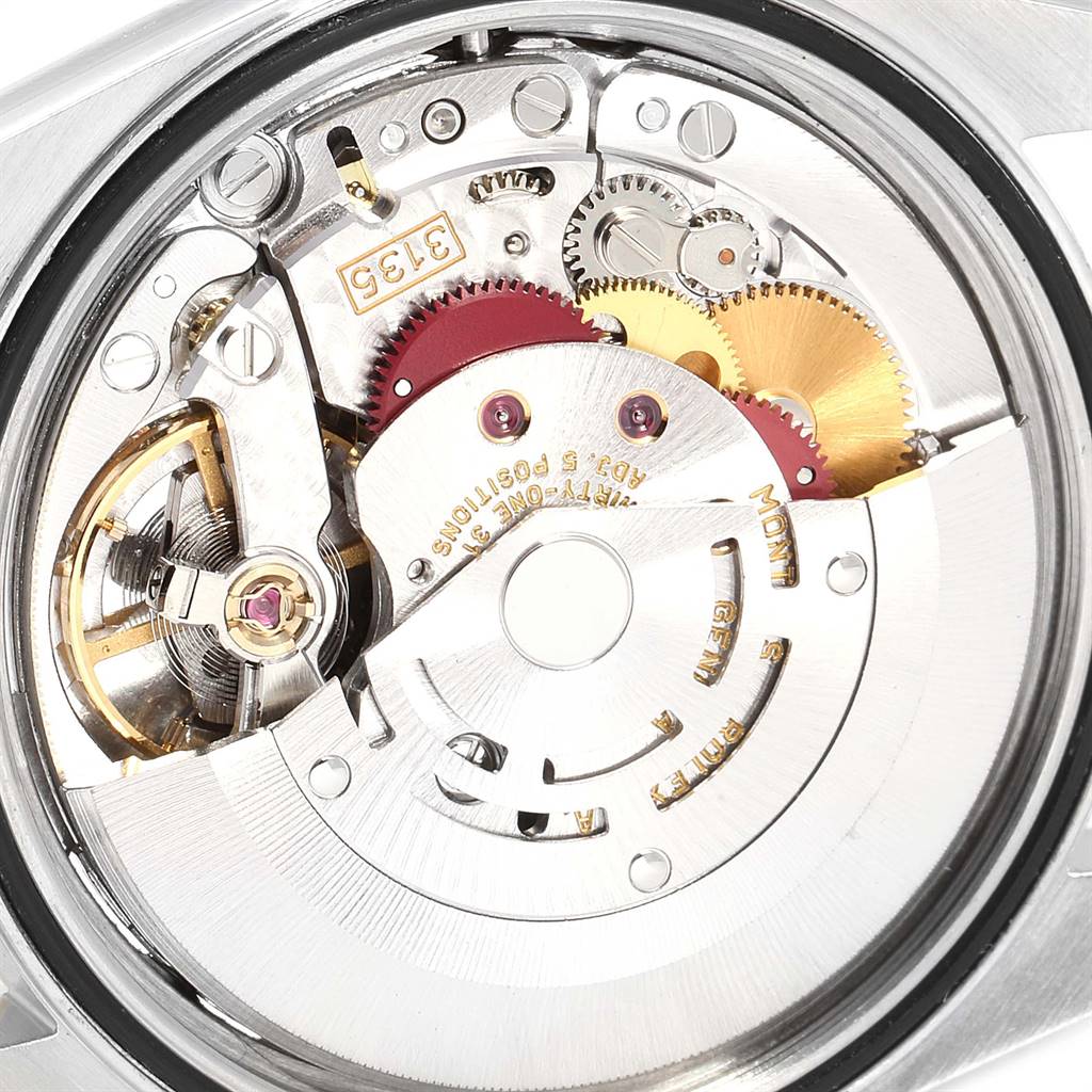 The image shows the inner mechanical movement of a Rolex Datejust 16233 Men's Steel and Gold (two tone) Champagne Dial 16233 Men's Steel and Gold (two tone) Champagne Dial watch with visible gears and parts.