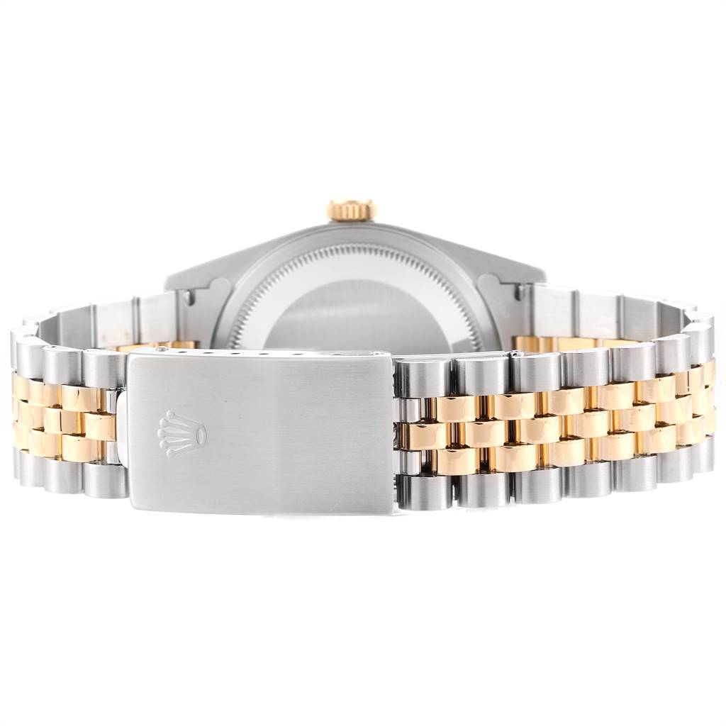 The image shows the back of the Rolex Datejust 16233 Men's Steel and Gold (two tone) Champagne Dial 16233 Men's Steel and Gold (two tone) Champagne Dial watch, highlighting the clasp and bracelet in a two-tone design.
