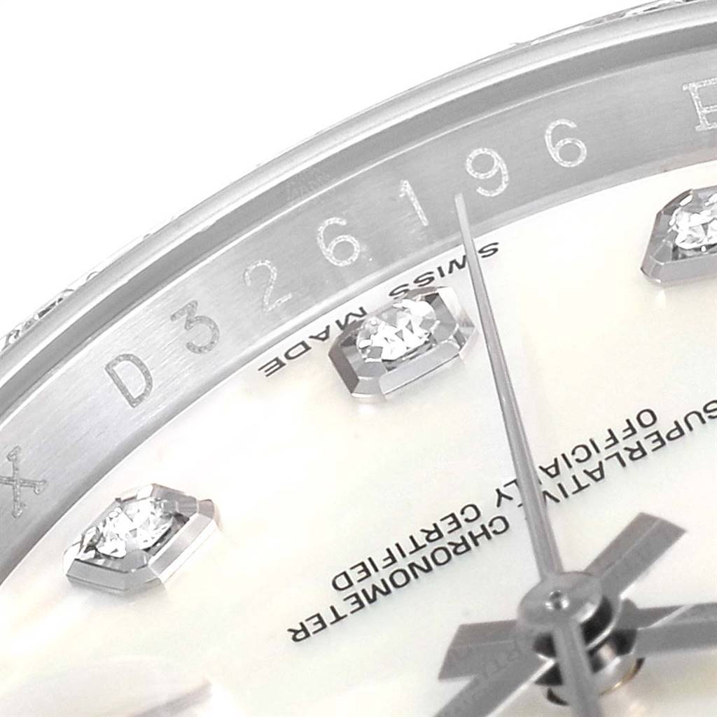 This image shows a close-up of the dial, diamond markers, and part of the serial number of a Rolex Datejust 116189 Men's White Gold Mother of Pearl Dial 116189 Men's White Gold Mother of Pearl Dial watch.