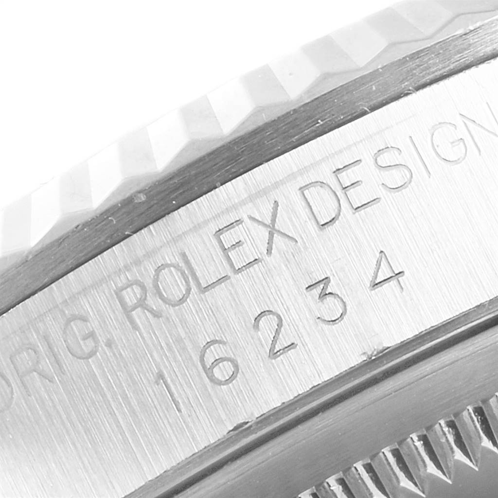 This close-up image shows the engraved side of the bezel and case of the Rolex Datejust 16234 Men's Stainless Steel White Dial 16234 Men's Stainless Steel White Dial watch, model number 16234.