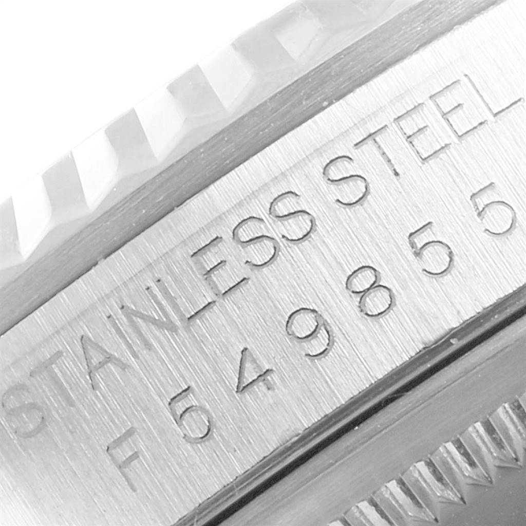 The image shows a close-up of the side of a stainless steel Rolex Datejust 16234 Men's Stainless Steel White Dial 16234 Men's Stainless Steel White Dial watch with the model number and material.