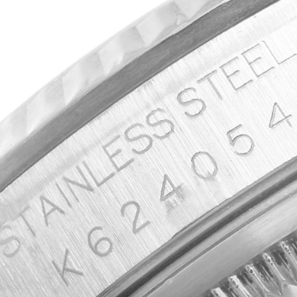 This close-up image shows the engraved stainless steel detail on the bezel of a Rolex Datejust 16234 Men's Stainless Steel Silver Dial 16234 Men's Stainless Steel Silver Dial watch.