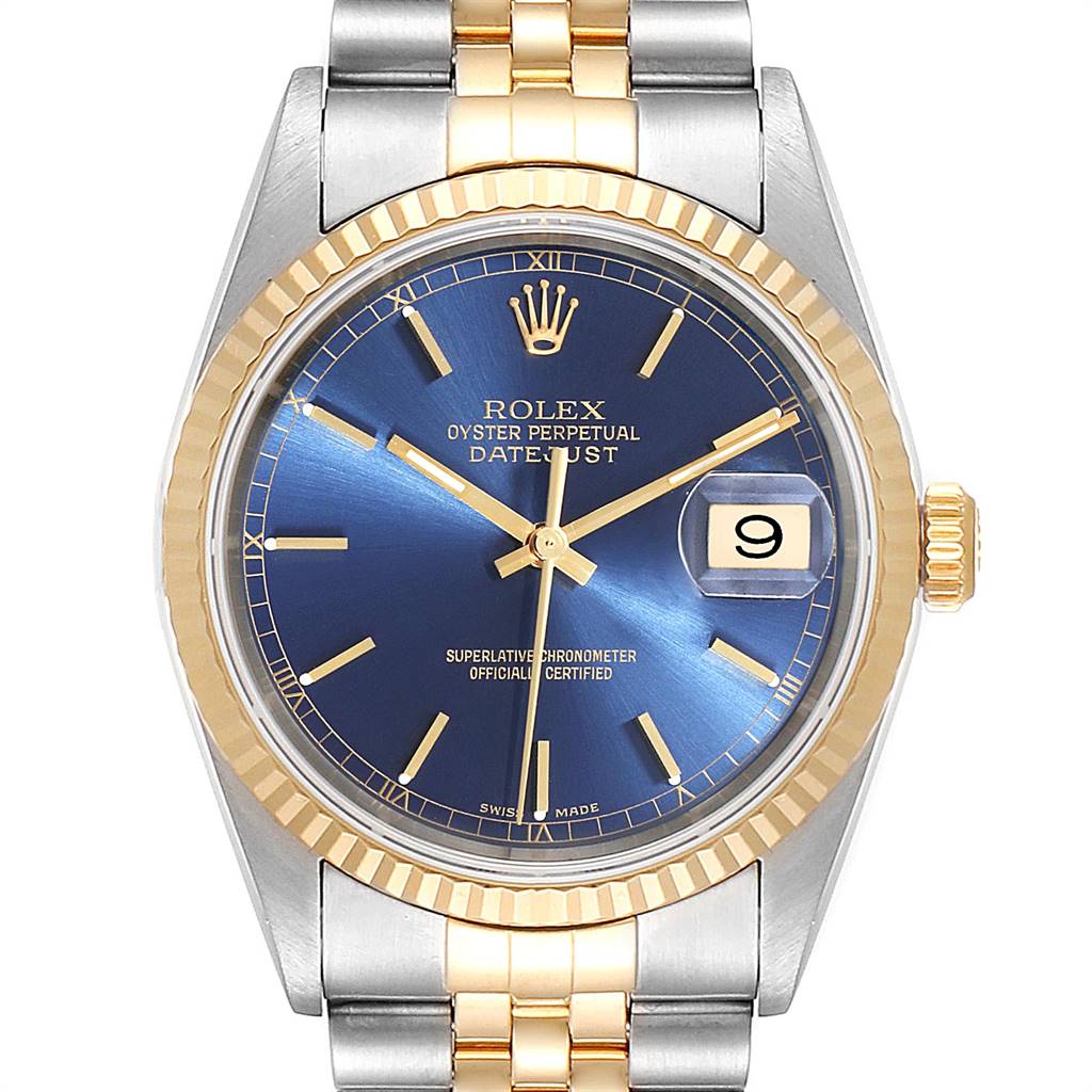 The image shows the front view of a Rolex Datejust 16233 Men
s Steel and Gold (two tone) Blue Dial 16233 Men
s Steel and Gold (two tone) Blue Dial watch, highlighting its blue dial, date window, and two-tone bracelet.