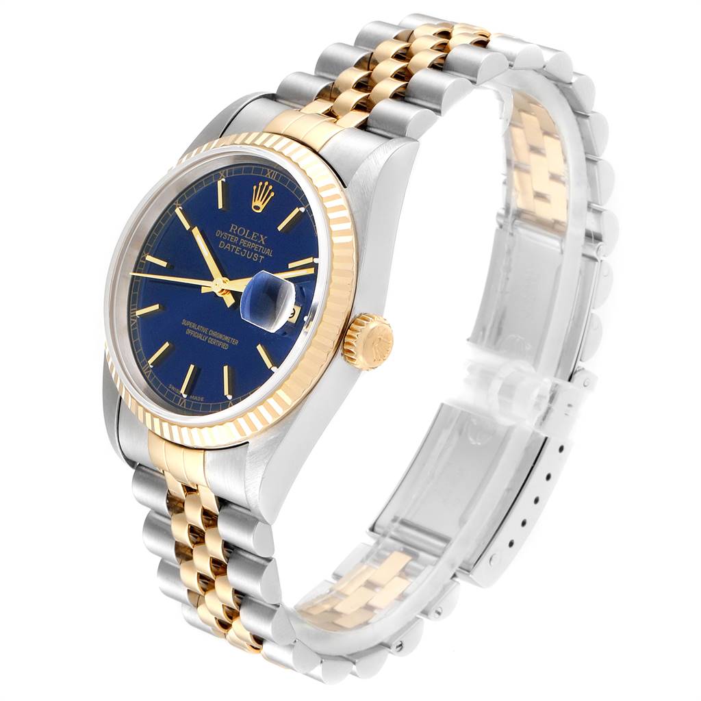 The image shows a side angle of the Rolex Datejust 16233 Men
s Steel and Gold (two tone) Blue Dial 16233 Men
s Steel and Gold (two tone) Blue Dial, highlighting its gold and silver bracelet, blue dial, and fluted bezel.