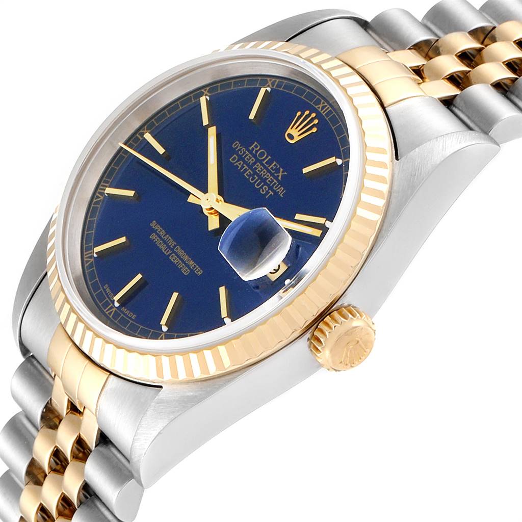 This image shows a Rolex Datejust 16233 Men
s Steel and Gold (two tone) Blue Dial 16233 Men
s Steel and Gold (two tone) Blue Dial watch at an angle, highlighting the face, bezel, crown, and part of the bracelet.