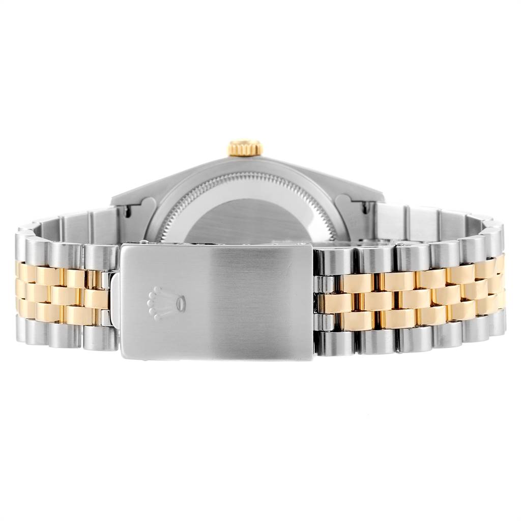 This image shows the back view of a Rolex Datejust 16233 Men
s Steel and Gold (two tone) Blue Dial 16233 Men
s Steel and Gold (two tone) Blue Dial watch focusing on the clasp and bracelet.