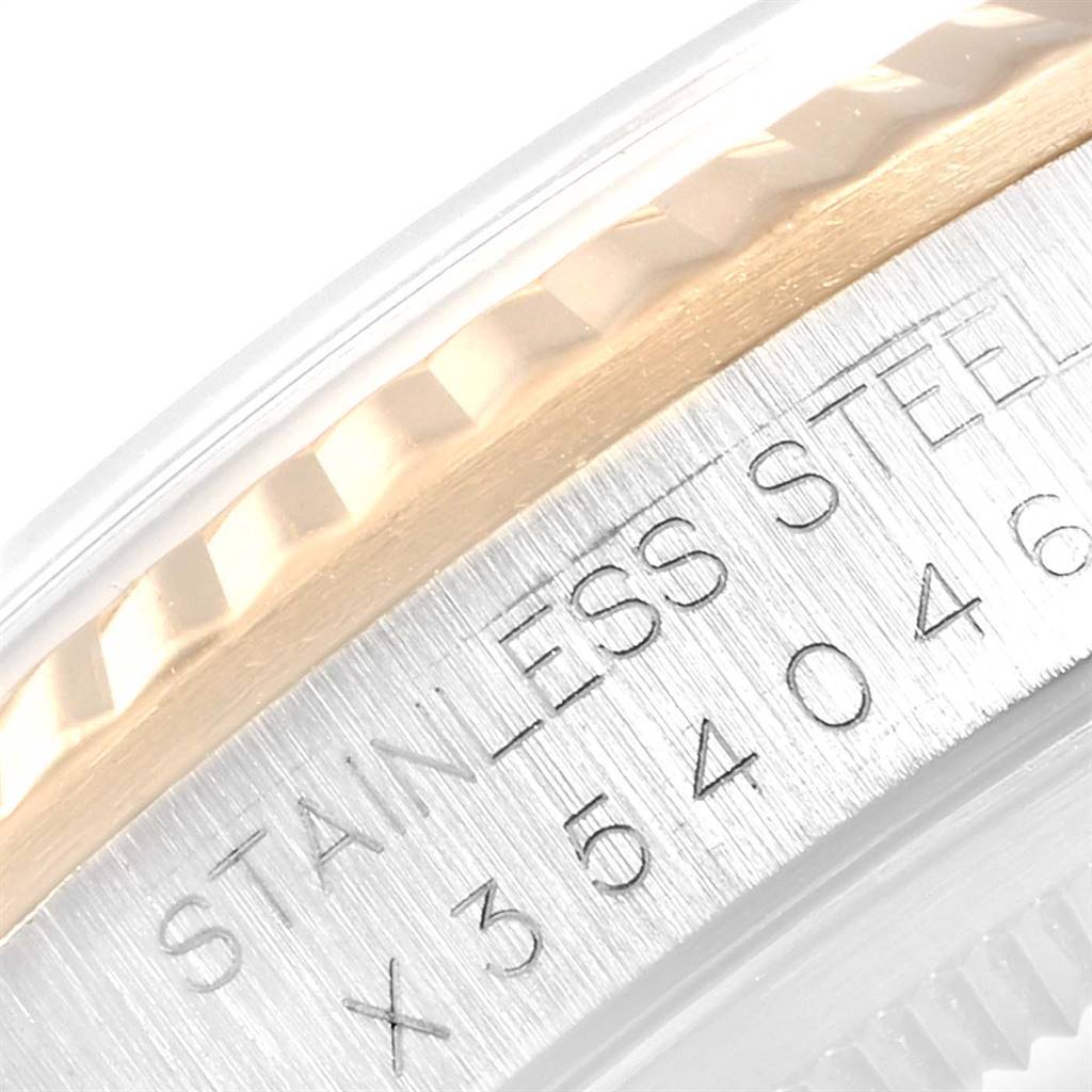 This image shows a close-up angle of the Rolex Datejust 16233 Men
s Steel and Gold (two tone) Black Dial 16233 Men
s Steel and Gold (two tone) Black Dial watch case, highlighting the stainless steel band and serial number engraving.