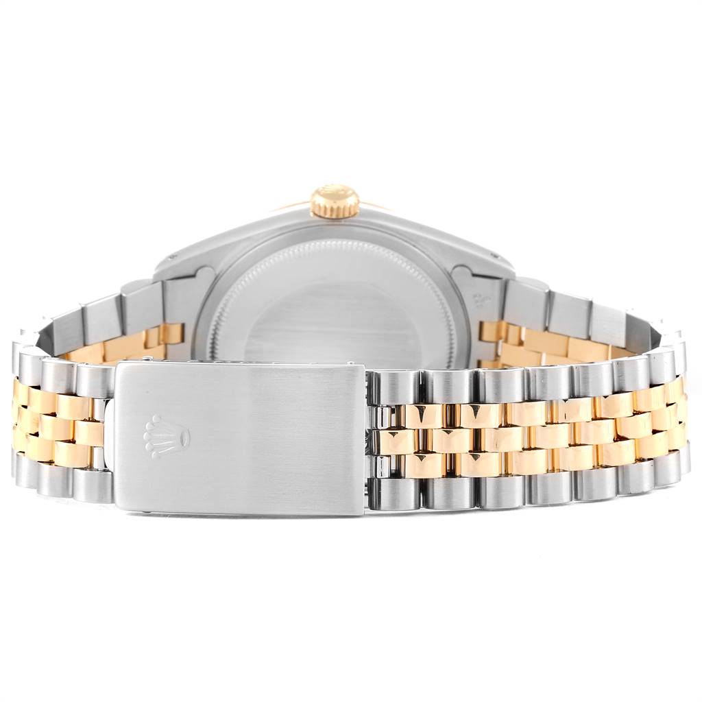 This image shows the back view of a Rolex Datejust 16233 Men
s Steel and Gold (two tone) Black Dial 16233 Men
s Steel and Gold (two tone) Black Dial watch, featuring its case back, crown, and two-tone bracelet clasp.