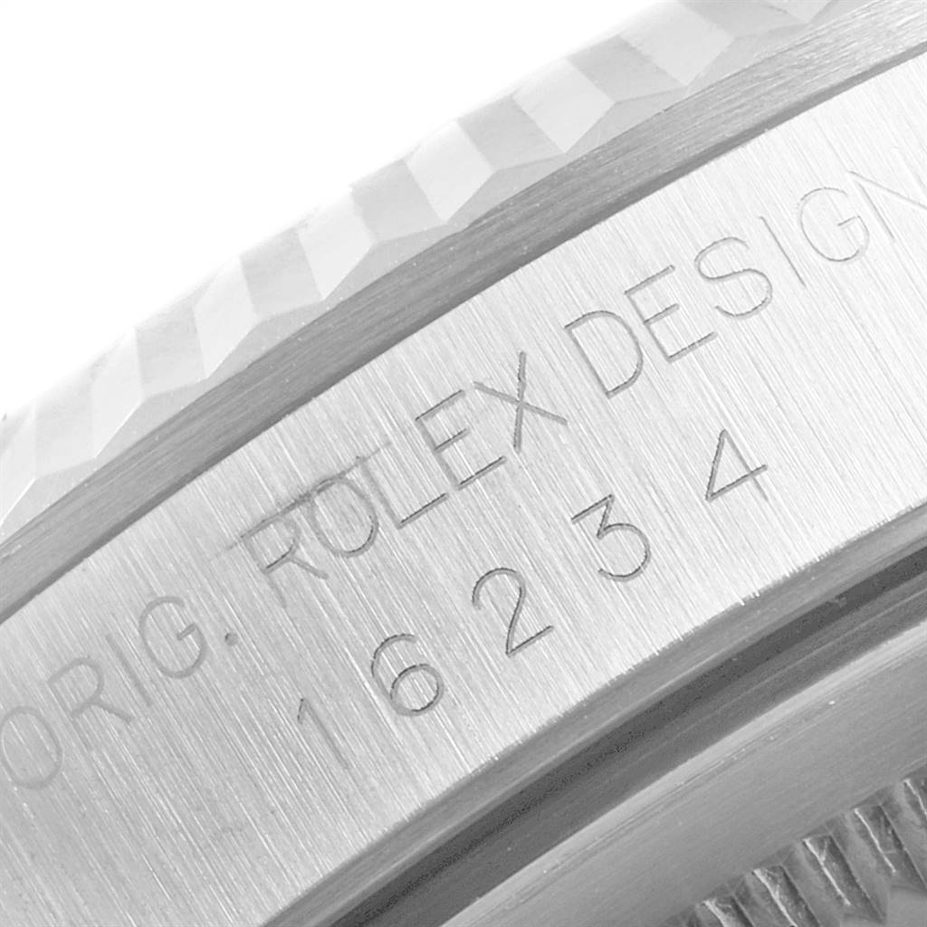 This image shows a close-up angle of the engraved casing of a Rolex Datejust 16234 Men's Stainless Steel Silver Dial 16234 Men's Stainless Steel Silver Dial watch.