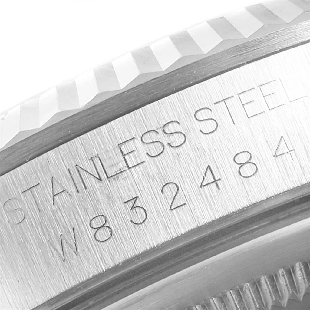 This close-up image shows the engraved serial number and part of the bezel of a Rolex Datejust 16234 Men's Stainless Steel Silver Dial 16234 Men's Stainless Steel Silver Dial watch.