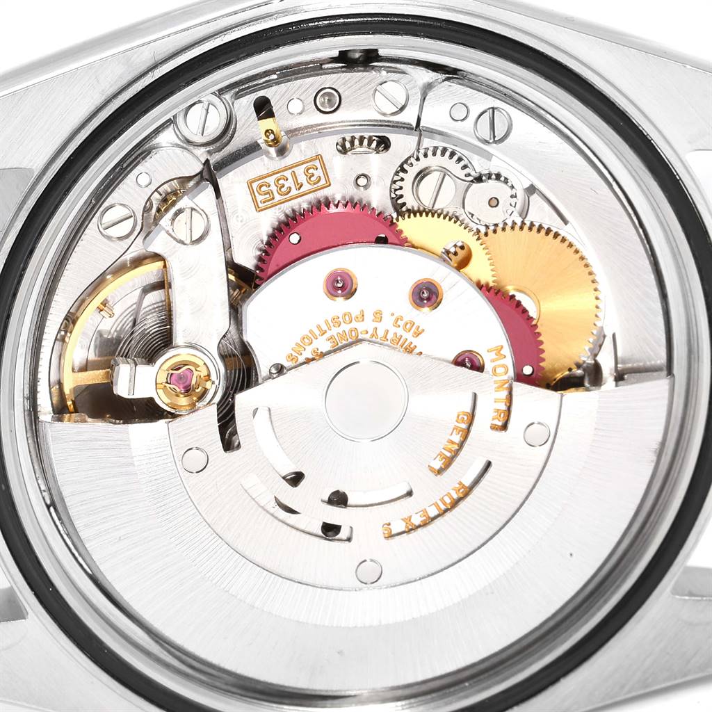 The image shows the intricate internal movement mechanism of a Rolex Datejust 16233 Men's Steel and Gold (two tone) White Dial 16233 Men's Steel and Gold (two tone) White Dial watch viewed from the back.