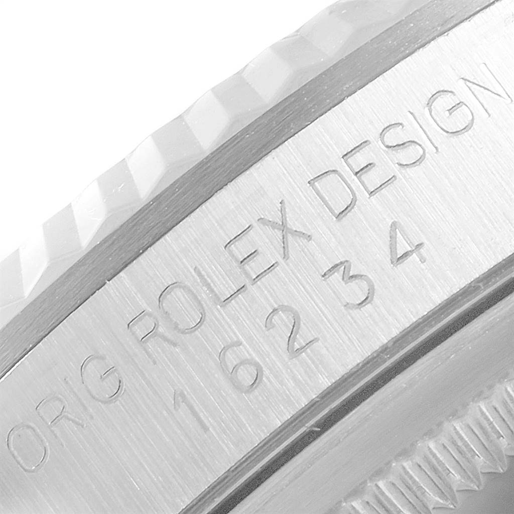 This close-up image shows the engraved side of the case and bezel of a Rolex Datejust 16234 Men's Stainless Steel Silver Dial 16234 Men's Stainless Steel Silver Dial watch.